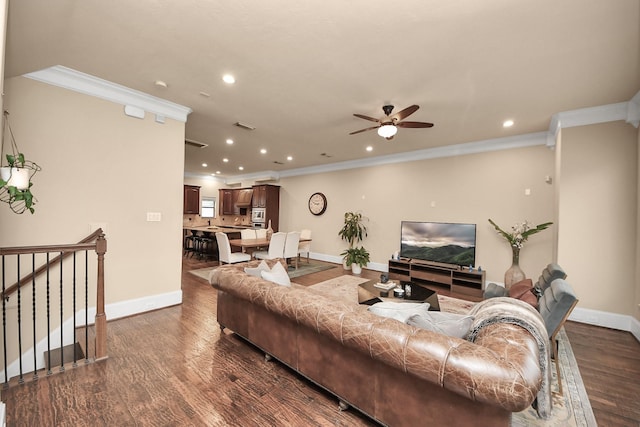 5341 Nolda St Unit E, Houston, TX 77007 - living room featuring crown molding, dark wood-style flooring, baseboards, and ceiling fan