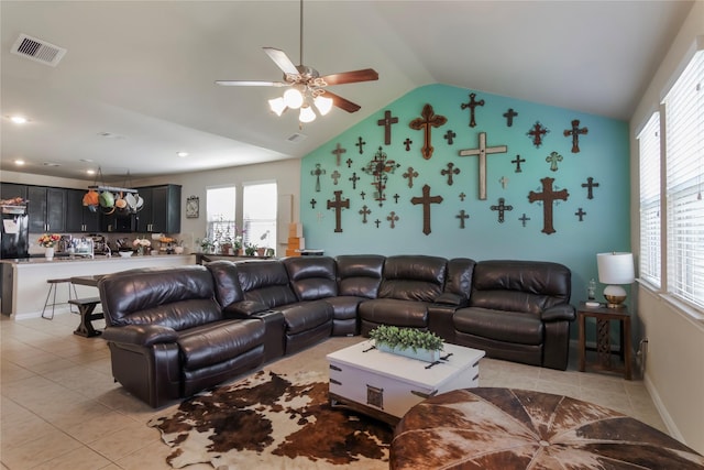 9530 Tipton Sands Dr, Humble, TX 77396 - living room with a ceiling fan, a healthy amount of sunlight, visible vents, light tile patterned flooring, and vaulted ceiling