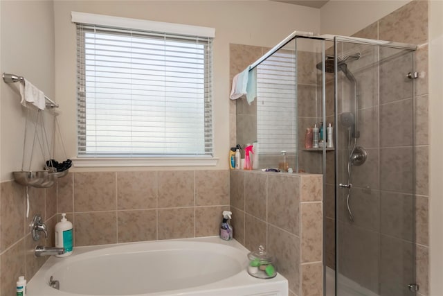 9530 Tipton Sands Dr, Humble, TX 77396 - full bathroom with a stall shower, plenty of natural light, and a bath