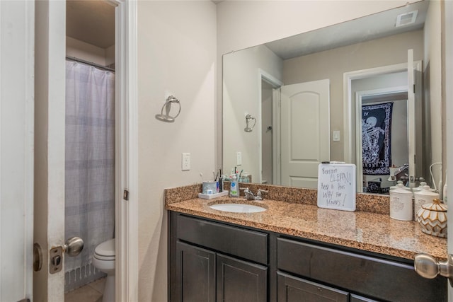 9530 Tipton Sands Dr, Humble, TX 77396 - bathroom with toilet, tile patterned floors, vanity, and visible vents