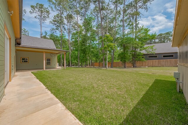 view of yard with a patio area and fence