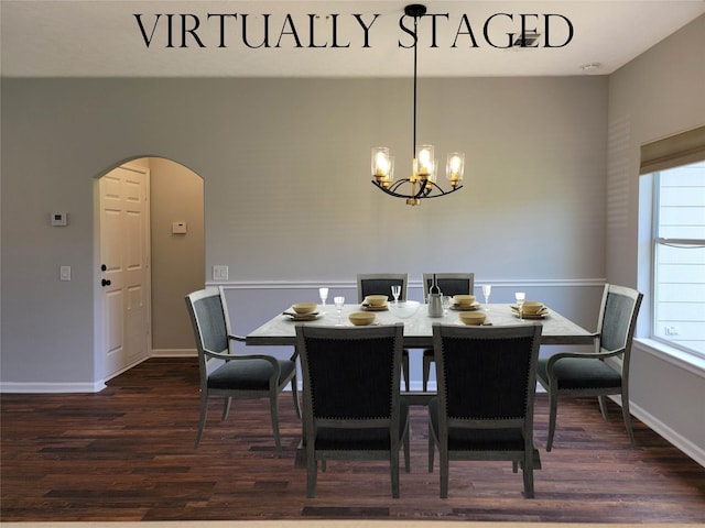 dining space with baseboards, arched walkways, a chandelier, and dark wood-style floors