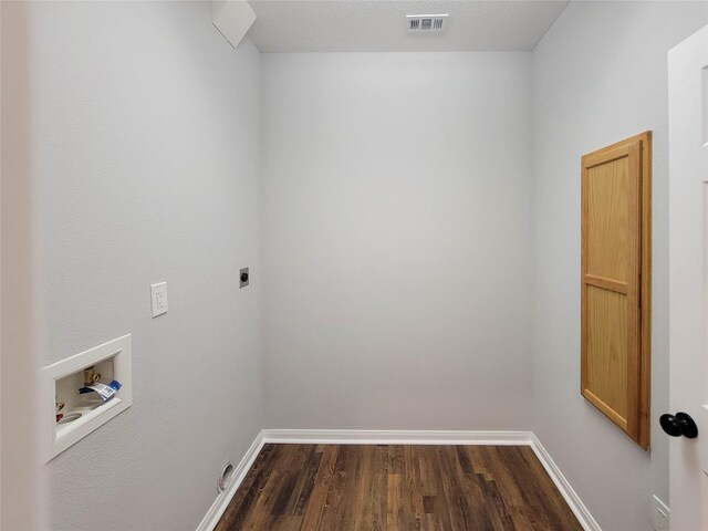 laundry room with laundry area, washer hookup, electric dryer hookup, dark wood-type flooring, and visible vents