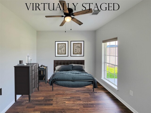 bedroom with baseboards, multiple windows, and dark wood-style flooring