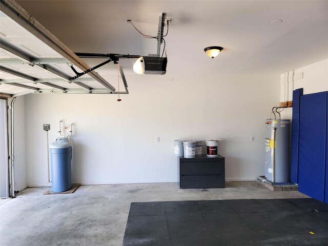 garage featuring a garage door opener and water heater