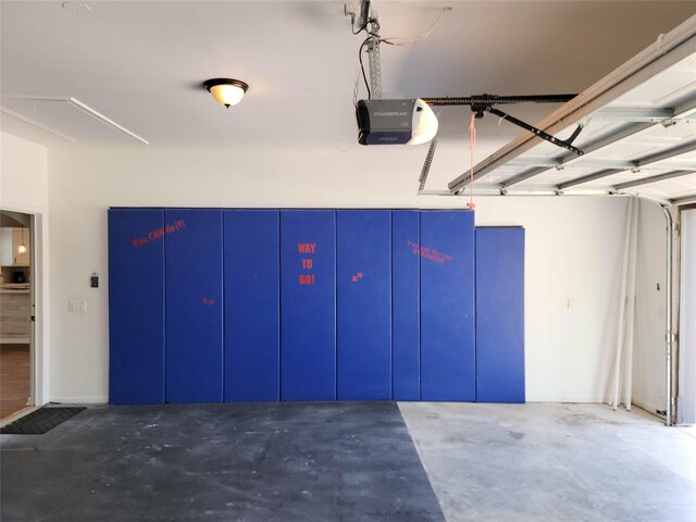 garage featuring a garage door opener