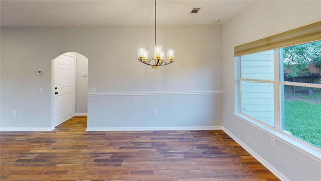 9267 Inlet Cir, Montgomery, TX 77356 - spare room with a chandelier, wood finished floors, arched walkways, and baseboards