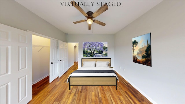 9267 Inlet Cir, Montgomery, TX 77356 - bedroom with wood finished floors, baseboards, a closet, and ceiling fan