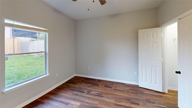 9267 Inlet Cir, Montgomery, TX 77356 - empty room with a ceiling fan, plenty of natural light, dark wood-style flooring, and baseboards