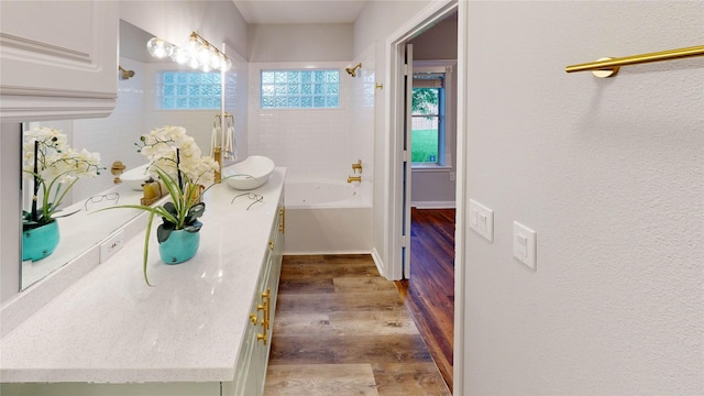 9267 Inlet Cir, Montgomery, TX 77356 - hallway featuring wood finished floors, a sink, and baseboards