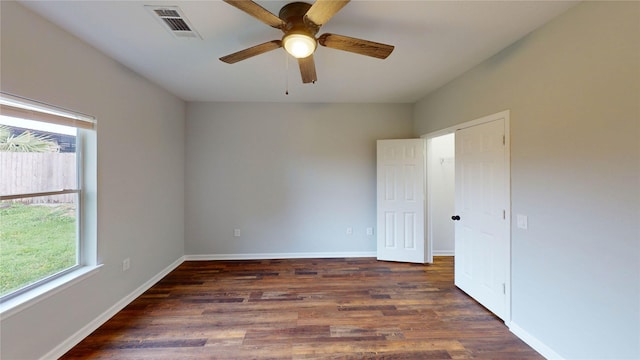 9267 Inlet Cir, Montgomery, TX 77356 - spare room with healthy amount of natural light, wood finished floors, a ceiling fan, and baseboards