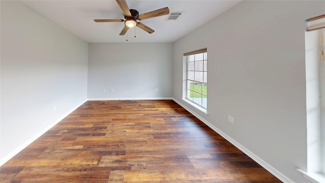 9267 Inlet Cir, Montgomery, TX 77356 - empty room featuring a ceiling fan, wood finished floors, and baseboards