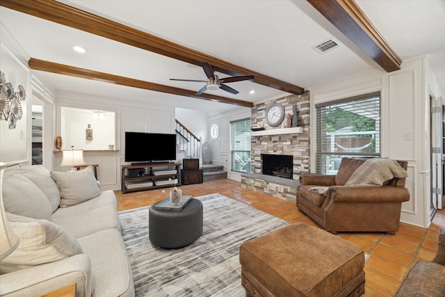 living area featuring ceiling fan, visible vents, beam ceiling, stairs, and light tile patterned flooring
