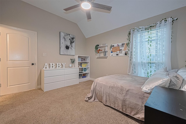 bedroom featuring carpet floors, ceiling fan, baseboards, and vaulted ceiling