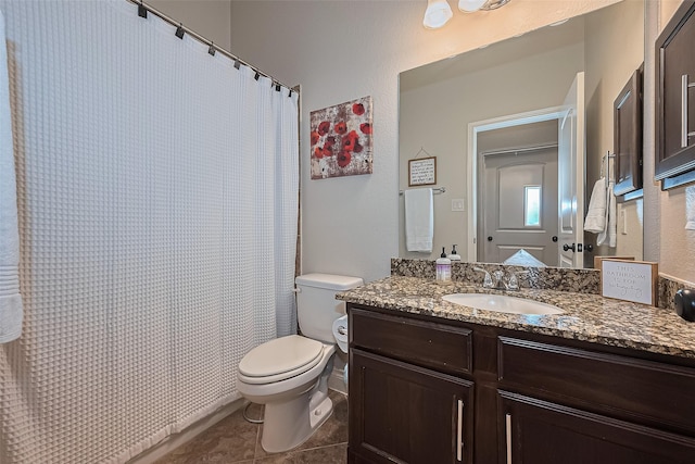 bathroom with toilet, tile patterned floors, a shower with shower curtain, and vanity