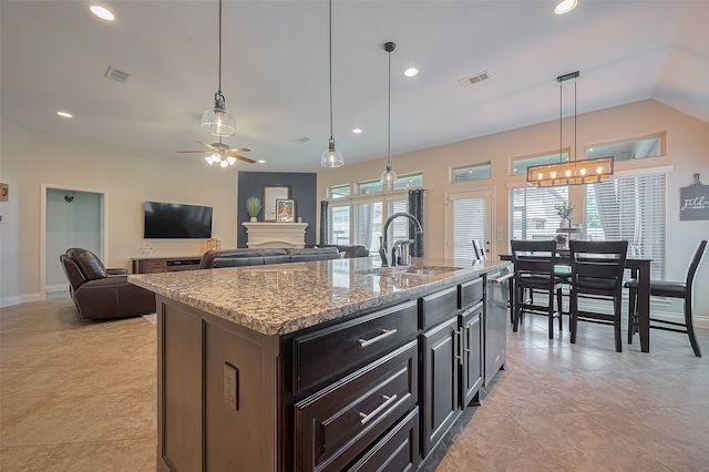 11918 Forest Moon Dr, Cypress, TX 77433 - kitchen with a sink, a ceiling fan, stainless steel dishwasher, light stone counters, and recessed lighting