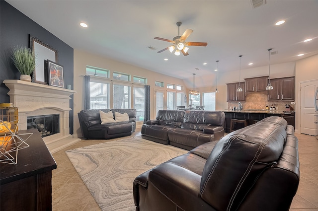11918 Forest Moon Dr, Cypress, TX 77433 - living room featuring a ceiling fan, recessed lighting, a glass covered fireplace, and light tile patterned flooring