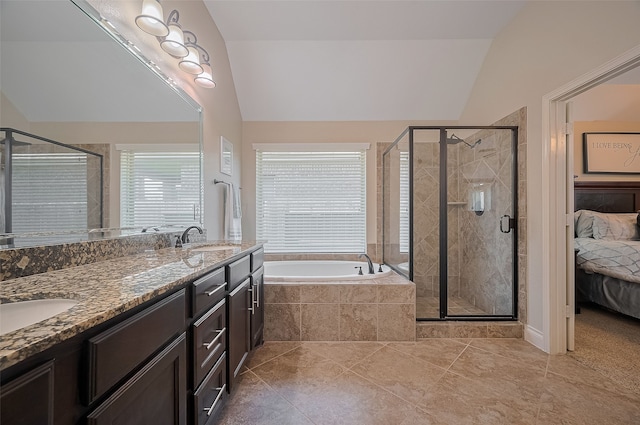 11918 Forest Moon Dr, Cypress, TX 77433 - bathroom with vaulted ceiling, a garden tub, ensuite bath, a shower stall, and tile patterned flooring