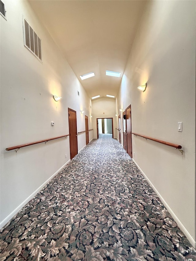 7110 W Mockingbird Ln, Pearland, TX 77584 - corridor featuring carpet floors, lofted ceiling, and baseboards