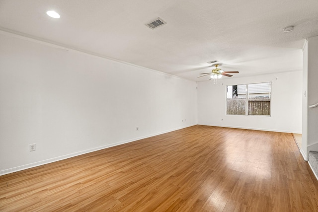19627 Lighthouse Scene Ln, Cypress, TX 77433 - spare room featuring a ceiling fan, baseboards, visible vents, and light wood-type flooring