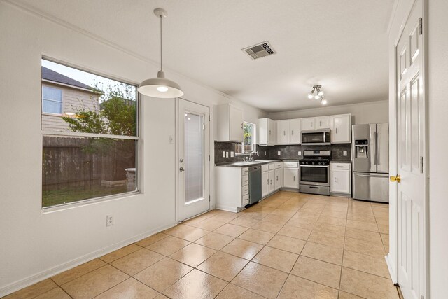 19627 Lighthouse Scene Ln, Cypress, TX 77433 - kitchen featuring visible vents, decorative backsplash, appliances with stainless steel finishes, and dark countertops