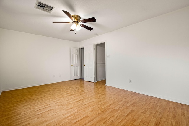 19627 Lighthouse Scene Ln, Cypress, TX 77433 - unfurnished room featuring a ceiling fan, baseboards, visible vents, and light wood-style floors