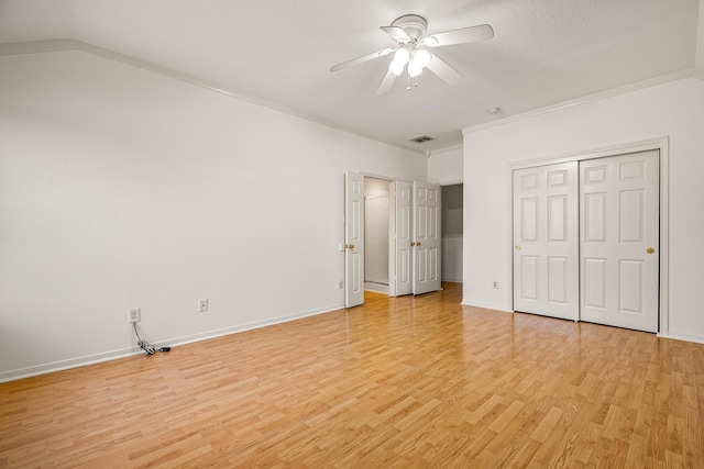 19627 Lighthouse Scene Ln, Cypress, TX 77433 - unfurnished bedroom featuring light wood-style floors, baseboards, a closet, and visible vents