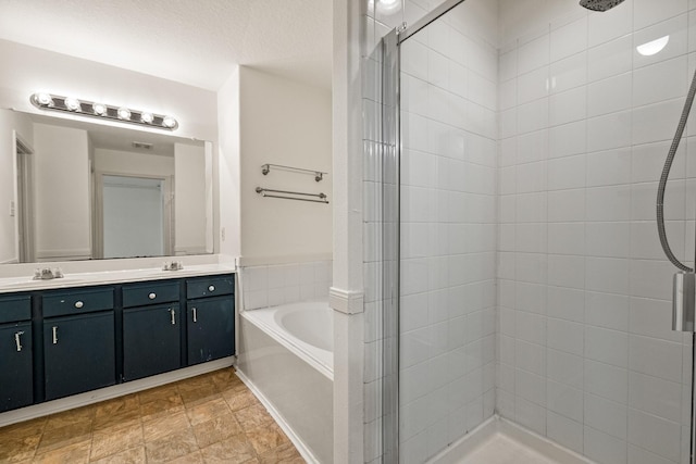 19627 Lighthouse Scene Ln, Cypress, TX 77433 - bathroom featuring a sink, double vanity, a stall shower, and a garden tub