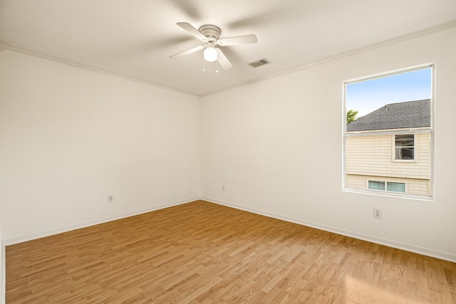 19627 Lighthouse Scene Ln, Cypress, TX 77433 - empty room with baseboards, ceiling fan, light wood-type flooring, and visible vents