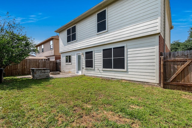 19627 Lighthouse Scene Ln, Cypress, TX 77433 - rear view of property featuring a yard, a fenced backyard, and a patio area