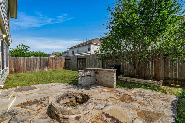 19627 Lighthouse Scene Ln, Cypress, TX 77433 - view of patio / terrace with a fenced backyard and a fire pit