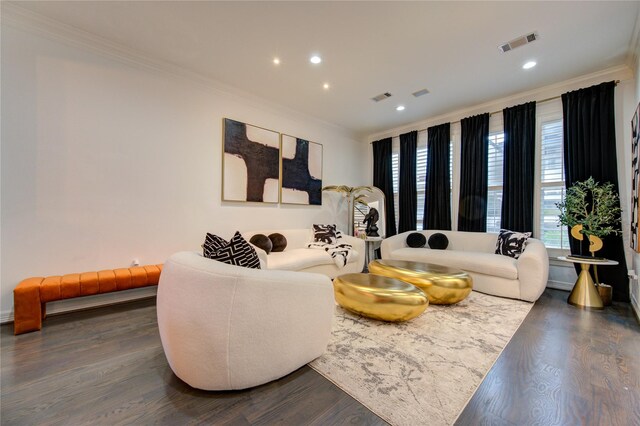 living area featuring crown molding, visible vents, and dark wood-style floors