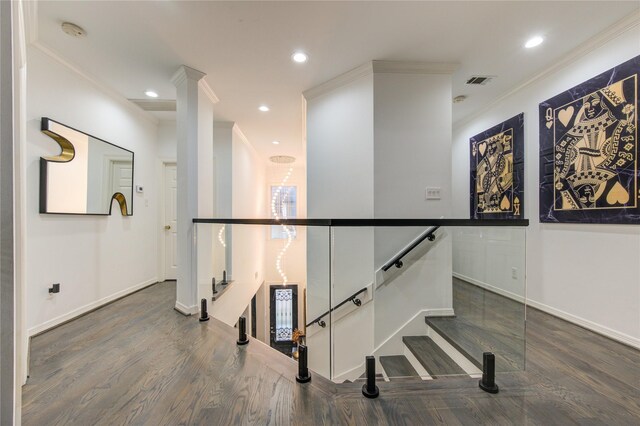 corridor with crown molding, dark wood finished floors, recessed lighting, baseboards, and visible vents