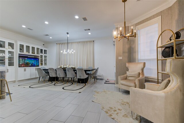 dining room featuring an inviting chandelier, ornamental molding, recessed lighting, and visible vents