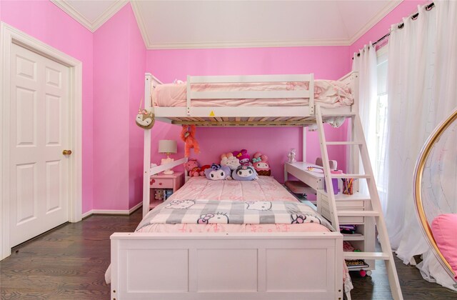 bedroom featuring dark wood-type flooring, ornamental molding, and baseboards