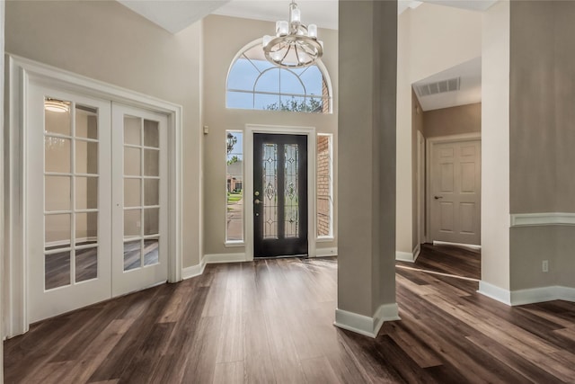 3515 Emerald Falls Ct, Houston, TX 77059 - entryway featuring a chandelier, dark wood-style flooring, french doors, baseboards, and a towering ceiling