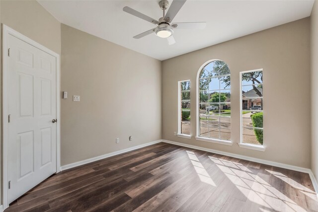 3515 Emerald Falls Ct, Houston, TX 77059 - spare room with baseboards, dark wood finished floors, and a ceiling fan