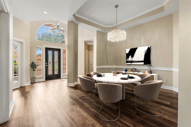 3515 Emerald Falls Ct, Houston, TX 77059 - dining space featuring a chandelier, wood finished floors, recessed lighting, baseboards, and a raised ceiling