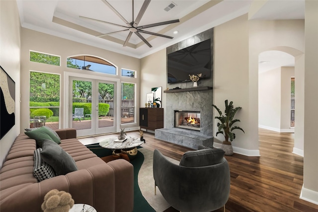 3515 Emerald Falls Ct, Houston, TX 77059 - living room with a fireplace, arched walkways, ornamental molding, wood finished floors, and a towering ceiling