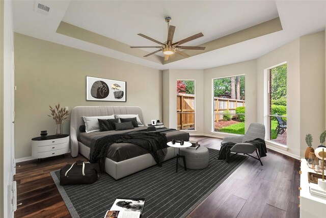 3515 Emerald Falls Ct, Houston, TX 77059 - bedroom with a raised ceiling, dark wood-style flooring, and baseboards