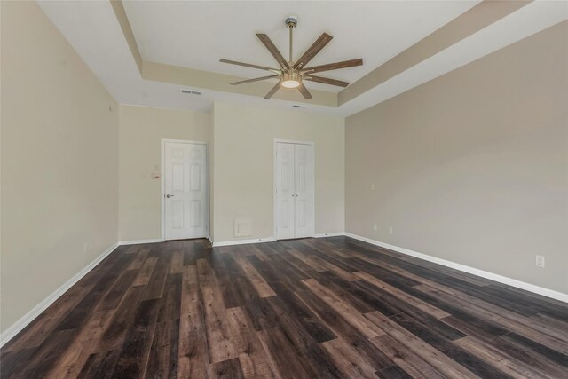 3515 Emerald Falls Ct, Houston, TX 77059 - unfurnished room featuring a raised ceiling, a ceiling fan, dark wood-style floors, and baseboards