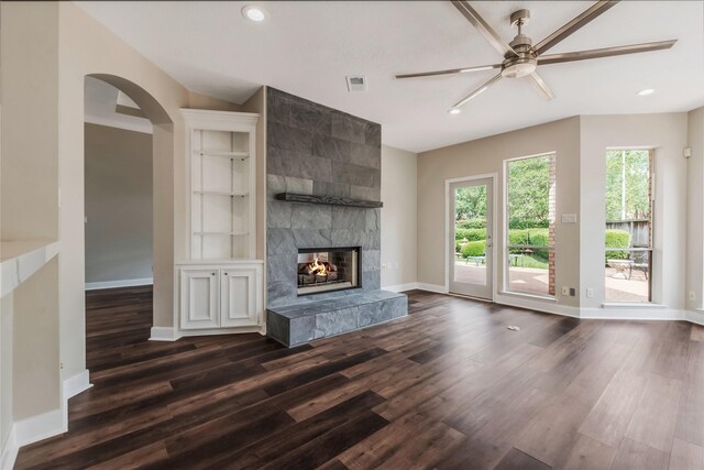3515 Emerald Falls Ct, Houston, TX 77059 - unfurnished living room featuring ceiling fan, dark wood-type flooring, a tiled fireplace, recessed lighting, and baseboards