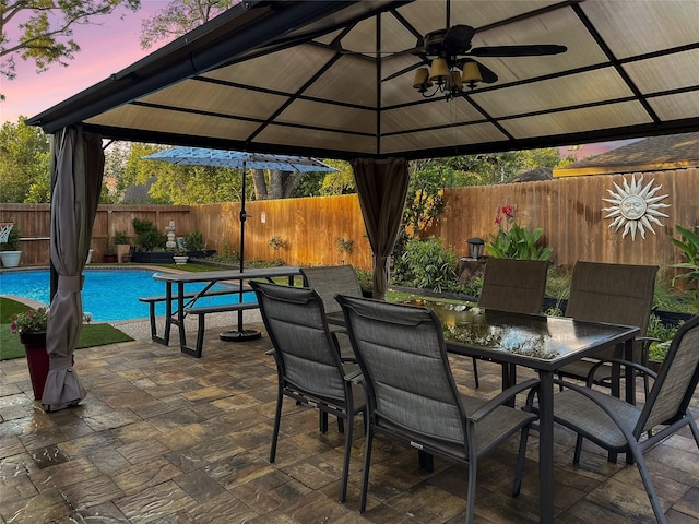 6803 Las Brisas Dr, Houston, TX 77083 - view of patio / terrace featuring a fenced backyard, outdoor dining area, a fenced in pool, and a gazebo