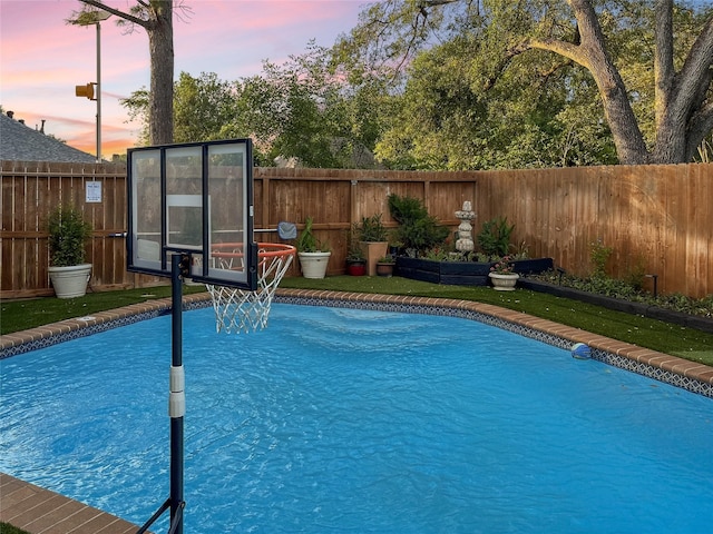 6803 Las Brisas Dr, Houston, TX 77083 - pool at dusk with a fenced in pool and a fenced backyard