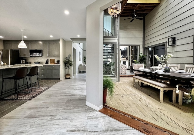 6803 Las Brisas Dr, Houston, TX 77083 - interior space featuring stairway, a ceiling fan, outdoor dining area, and outdoor wet bar
