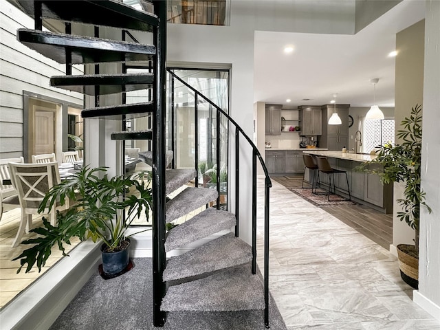 6803 Las Brisas Dr, Houston, TX 77083 - stairs featuring recessed lighting