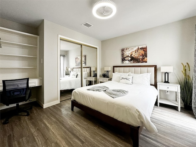 6803 Las Brisas Dr, Houston, TX 77083 - bedroom with visible vents, wood finished floors, and a closet