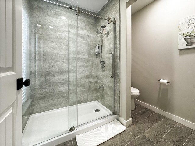 6803 Las Brisas Dr, Houston, TX 77083 - full bath with baseboards, a shower stall, and toilet