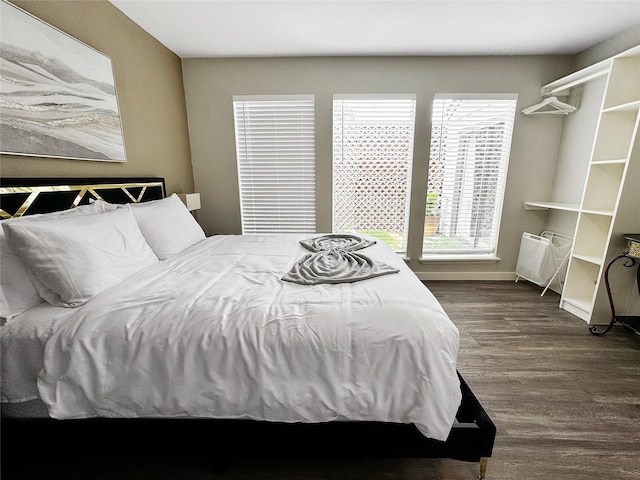 6803 Las Brisas Dr, Houston, TX 77083 - bedroom featuring dark wood-style flooring and baseboards