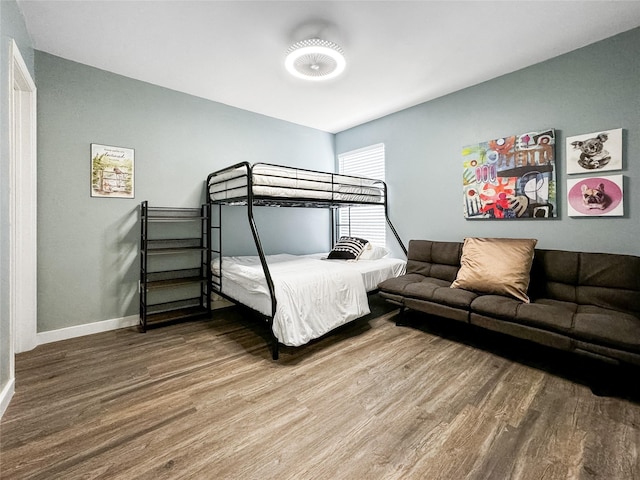 6803 Las Brisas Dr, Houston, TX 77083 - bedroom featuring baseboards and wood finished floors